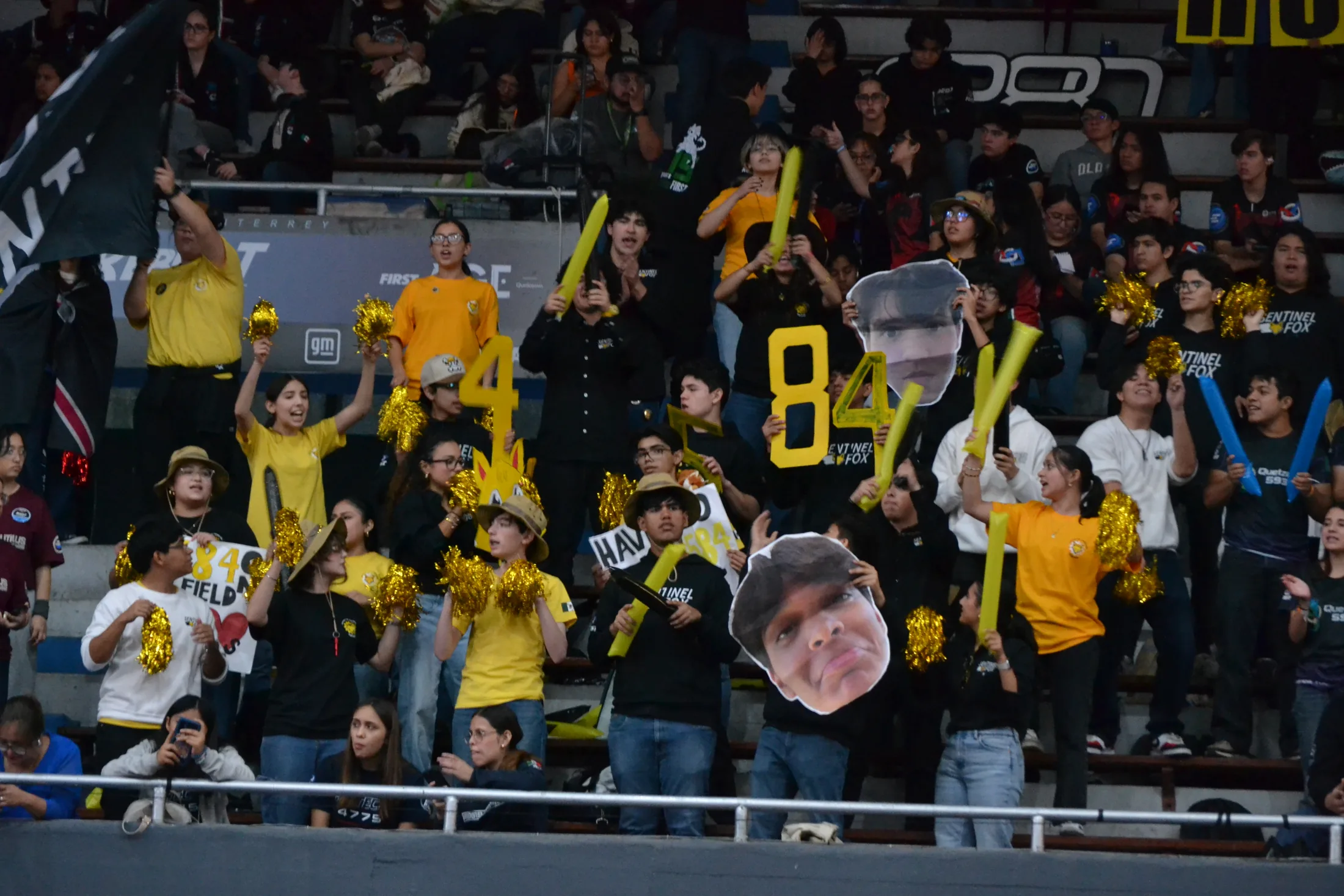 Sentinel Fox signs in the crowd