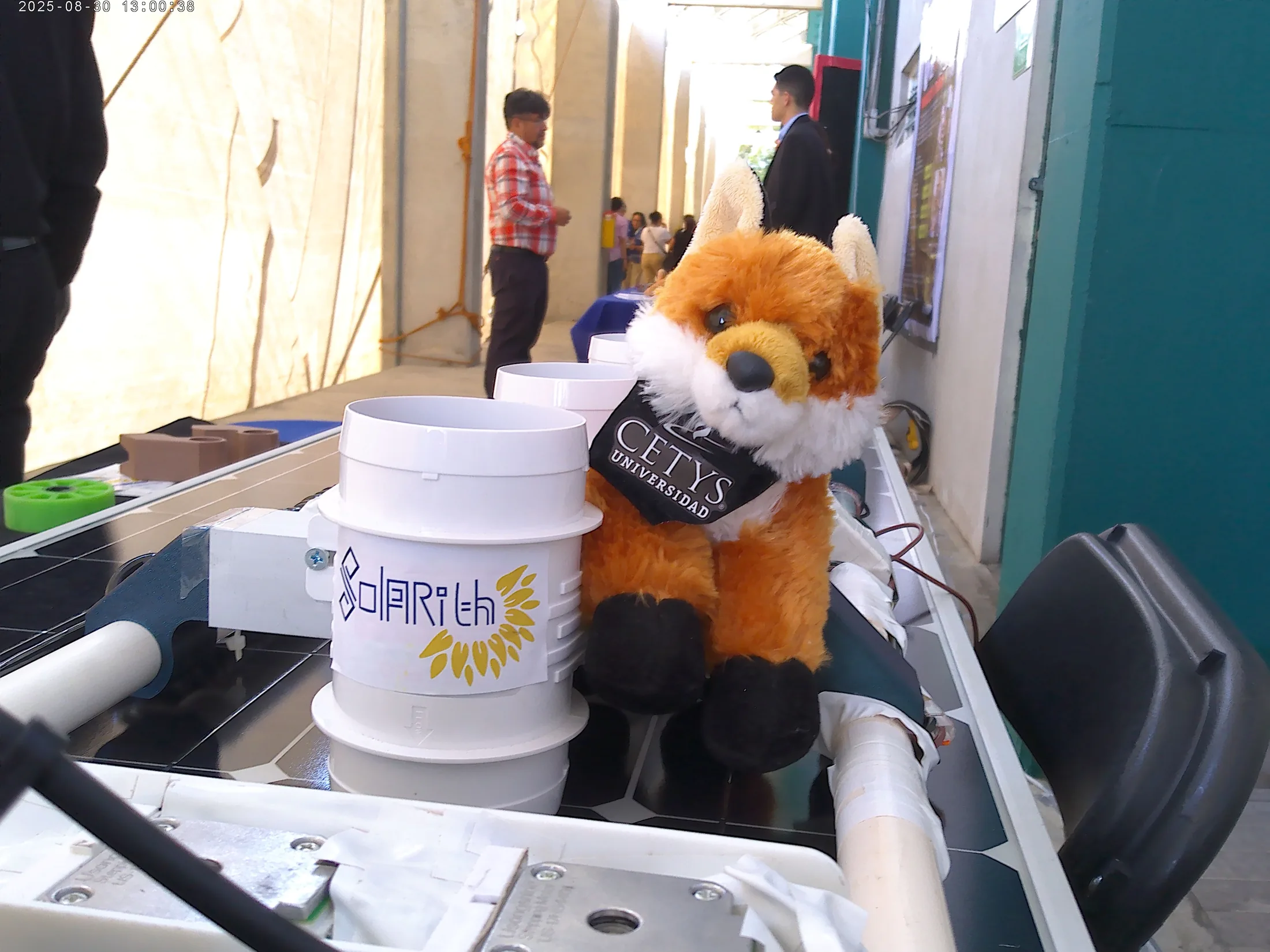 Solarith robot with Sentinel Fox mascot